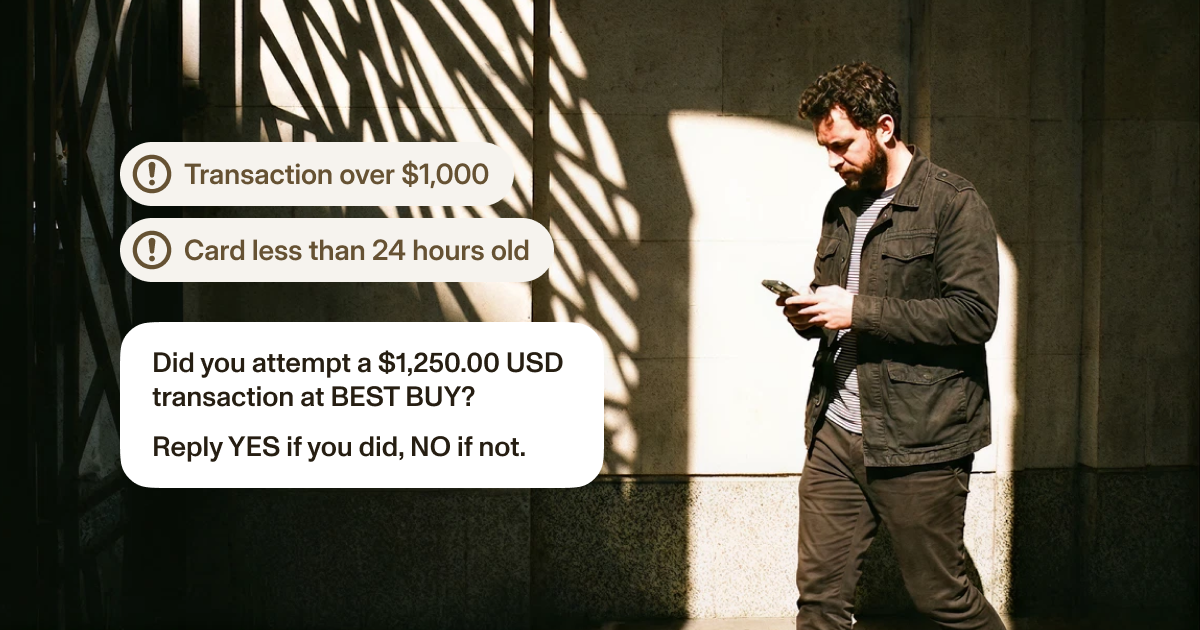 A cardholder receiving an SMS challenge to confirm a high-value transaction